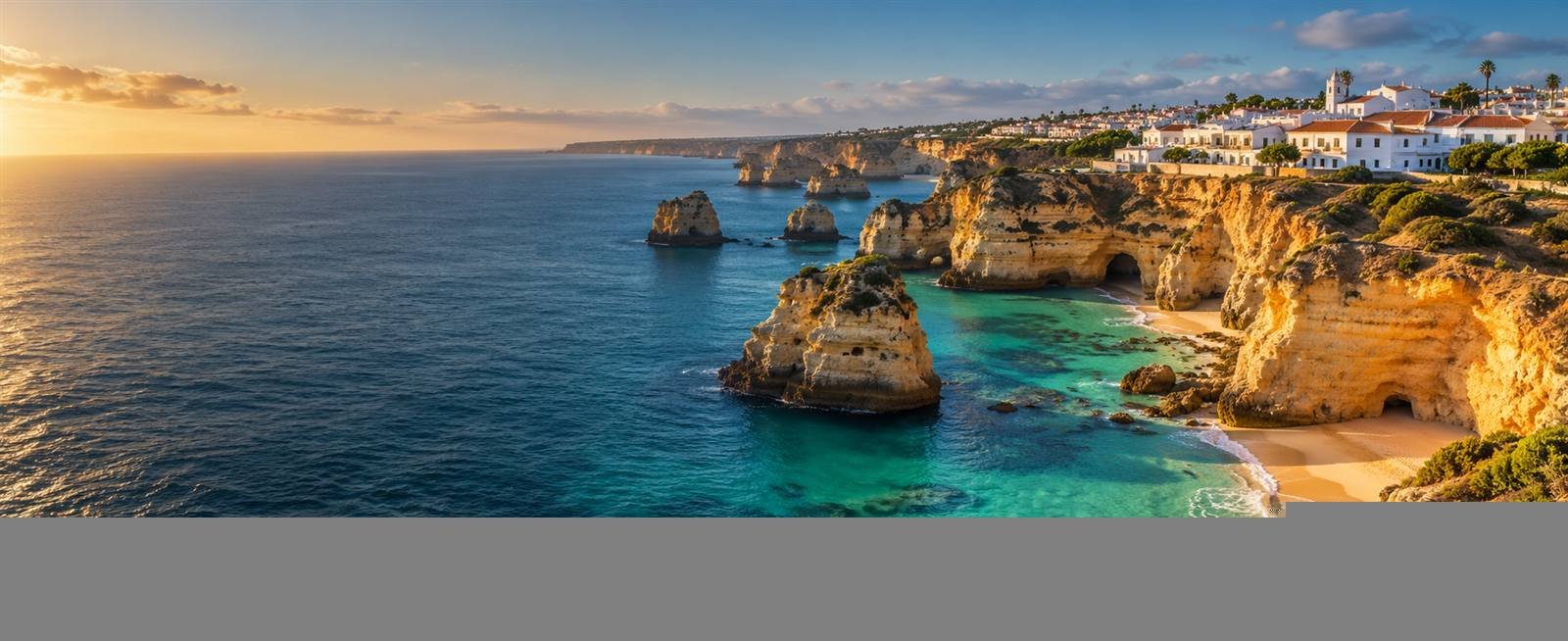 Golden Algarve cliffs beside turquoise Atlantic water
